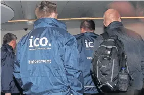  ?? YUI MOK ?? Enforcemen­t officers working for the Informatio­n Commission­er’s Office entering the offices of Cambridge Analytica in central London