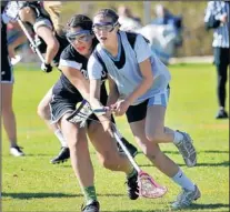  ??  ?? Rio Rancho’s Selena McClung, left, battles Rachel Sledzik, from Los Alamos and playing for Santa Fe Prep, in Thursday’s game at Prep.