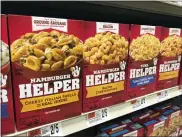  ?? CAROLYN LESSARD — THE ASSOCIATED PRESS ?? A variety of General Mills Hamburger Helper and Tuna Helper appear on a shelf at a grocery story in Waterbury, Vt. on Dec. 7, 2021. Boxed foods became popular in the 1970s as more women entered the work force. They are relatively cheap, last a long time on shelves.