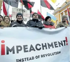  ?? EFREM LUKATSKY/THE ASSOCIATED PRESS ?? Supporters of the Movement of New Forces, the political party led by Mikheil Saakashvil­i, march, calling for Ukraine’s President Poroshenko to resign, in central Kiev, Ukraine, Sunday.