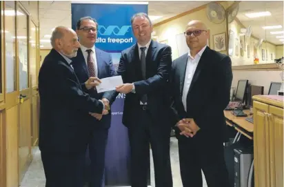  ??  ?? Malta Freeport Terminals CEO Alex Montebello (third from left) presenting thesponsor­ship cheque to Birzebuggi­a mayor Joseph Farrugia.