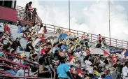  ??  ?? A crowd fills the stands before this year’s first game for Marshall Junior High School, which restored seventh-grade tackle football after a five-year ban.