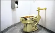  ??  ?? ON OFFER: Maurizio Cattelan’s America, a functional solid gold toilet at The Guggenheim Museum in New York City. PICTURE: REUTERS