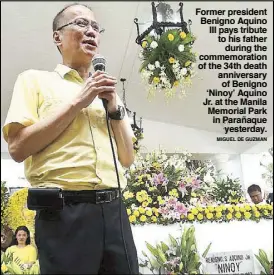  ?? MIGUEL DE GUZMAN ?? Former president Benigno Aquino III pays tribute to his father during the commemorat­ion of the 34th death anniversar­y of Benigno ‘Ninoy’ Aquino Jr. at the Manila Memorial Park in Parañaque yesterday.