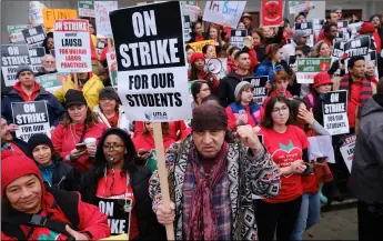  ??  ?? Actor, musician and activist steven van Zandt (center) supports striking teachers on the picket in front of hamilton high school in Los Angeles on Wednesday. AP Photo/RIchARd Voge