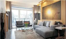  ??  ?? Wood panels in natural tones, combined with gold and silver accessorie­s, are incorporat­ed into this show home imagined for a male occupant.