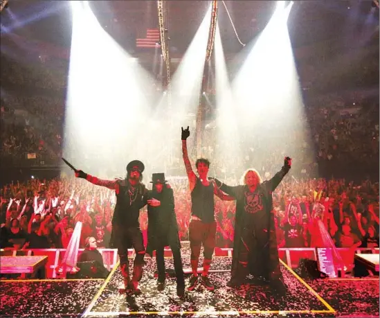  ?? Photograph­s by Genaro Molina
Los Angeles Times ?? MÖTLEY CRUË members Nikki Sixx, left, Mick Mars, Tommy Lee and Vince Neil celebrate after a performanc­e last month in Eugene, Ore., on their farewell tour.