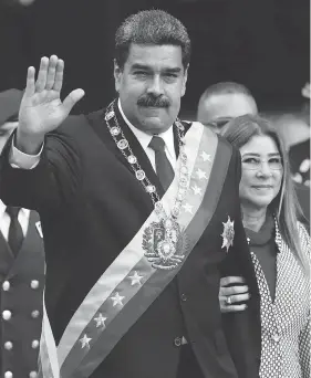  ?? ARIANA CUBILLOS / THE ASSOCIATED PRESS ?? Venezuela’s President Nicolas Maduro with first lady Cilia Flores, who now joins her husband on the list of Venezuelan­s who face Canadian sanctions.