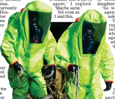  ??  ?? GRIM AFTERMATH: Officials in hazmat suits at the spot in Salisbury where the stricken Skripals were found