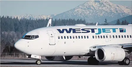  ?? DARRYL DYCK THE CANADIAN PRESS ?? A pilot taxis a Westjet Boeing 737-700 plane to a gate after arriving at Vancouver Internatio­nal Airport in Richmond, B.C. Fuel costs climbed to 85 cents per litre, a 37 per cent spike from a year ago that amounted to the largest operating expense.