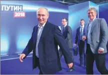  ?? ALEXEI DRUZHININ / SPUTNIK ?? Russian President V ladimir Putin visits his campaign headquarte­rs in Moscow on Sunday. Put in won a fourth term with 76.6 percent of the vote on Monday.