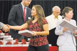  ?? Bridget Bennett ?? Las Vegas Review-journal @bridgetkbe­nnett Monica Arebalos, one of UNLV’S first medical students, gets her stethoscop­e Monday.