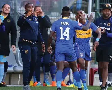  ??  ?? UNITED IN SCORING: Cape Town City coach Benni McCarthy and striker Nana Akosah-Bempah celebrate a team goal.