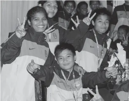  ??  ?? Striker Roja Devi celebrates India’s 2- 1 win over Bangladesh with team mates in Dhaka on Sunday.