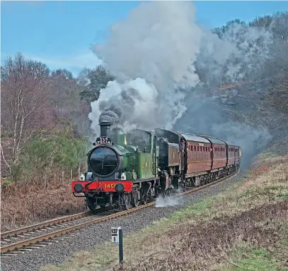  ??  ?? Above: Hoping to be back soon, Mike Little's Collett 0-4-2T No. 1450 is pictured double-heading with WR 0-6-0PT No. 1501 out of Foley Park Tunnel on the Severn Valley Railway on March 16, 2018. JOHN TITLOW