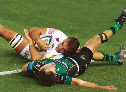  ?? PICTURES: Getty Images ?? Crash ball: Sean Lonsdale smashes George Furbank to score Exeter’s first try