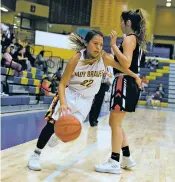  ?? JASON STILGEBOUE­R/FOR THE NEW MEXICAN ?? Santa Fe Indian School sophomore Hunter Garcia, left, drives around Portales’ Zamorye Cox during the Bobby Rodriguez Capital City Tournament championsh­ip game Saturday in Toby Roybal Memorial Gymnasium. Garcia finished with 15 points, but SFIS lost...