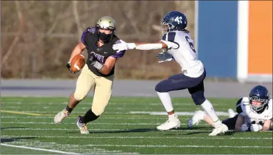  ?? Photos by Louriann Mardo-Zayat / lmzartwork­s.com ?? St. Raphael running back Napoleon DeBarros (34) runs past a Moses Brown linebacker during the first half of the Saints’ 33-0 Division II victory over the Quakers Sunday night at Max Read Field. The Saints are now 3-0.