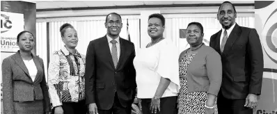  ?? CONTRIBUTE­D ?? Minister of Finance and the Public Service Dr Nigel Clarke (third left), along with (from left) Carlene Smith, deputy financial secretary, Corporate Planning and Administra­tion Division, Ministry of Finance and the Public Service; Sandra Fairclough, acting principal finance officer in the ministry; Roxann Linton, chief executive officer, First Heritage Cooperativ­e Credit Union; Lorna Phillips, chair, Civil Service Week 2019 Steering Committee; and O’Neil Grant, president, Jamaica Civil Service Associatio­n, during the launch of Civil Service Week at the ministry’s office in Kingston on Wednesday.