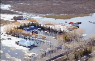  ?? SUBMITTED PHOTO ?? An aerial view of overland flooding of a farm in the MD of Taber.