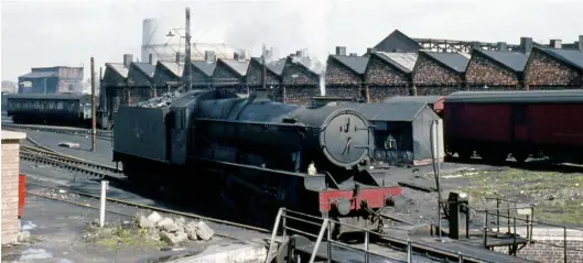  ?? C Smith/Kiddermins­ter Railway Museum ?? Nine months after its last heavy general overhaul, No 1014 County of Glamorgan by now has around 750,000 miles to its name but is looking unloved when recorded at Shrewsbury shed on 21 April 1963. There is no number or shedplate on the smokebox door, Shrewsbury being home for this 4-6-0 since its transfer from Neyland in the four-weeks ending 9 March 1963. No 1014 is in its final form, complete with double-chimney gained in May 1958 – the first post-developmen­tal fitting of these was on No 1022 County of Northampto­n in May 1956. I cherish memories of the ‘County’ 4-6-0s on the lines around Shrewsbury, doubtless inspiring my work with the 1014 GWR County Project. The original locomotive was transferre­d to Swindon in September 1963 and it was not finally withdrawn until 24 April 1964. Bought as scrap by John Cashmore in Newport, by the end of September 1964
County of Glamorgan was on hand for cutting.
