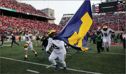  ?? (AP PHOTO/JAY LAPRETE) ?? Michigan is hoping to win consecutiv­e Big Ten titles for the first time since 2003-04. The Wolverines have 14 straight conference victories, their longest since an 18-game league run from 1996-98.