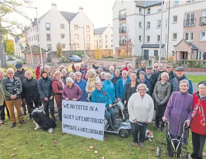  ??  ?? Residents gather outside Scholars gate retirement flats to protest plans for the hotel developmen­t.