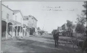  ?? COURTESY OF POMONA PUBLIC LIBRARY ?? Constable Frank O. Slanker stands on a dusty downtown Pomona street around 1887, the year he joined the new city. He had a remarkable career in law enforcemen­t in Pomona, serving 45years until his death in 1932. Criminals quickly learned that they would be better off staying away from Pomona and Slanker. One criminal with a rifle learned that an unarmed Slanker was closing in on him and simply surrendere­d rather than battle the tough lawman.