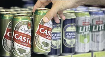  ?? PHOTO: BLOOMBERG ?? An employee restocks shelves with Castle beer, which is produced by SABMiller, at a Durban bottle store. SABMiller, having rejected four previous proposals, finally relented when Anheuser-Busch InBev agreed to increase the offer.