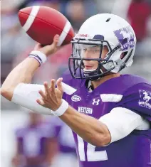  ?? MIKE HENSEN ?? Fourth-year quarterbac­k Chris Merchant leads the defending national champion Western Mustangs into this year’s U Sports conference playdowns. Both Western and Laval have 8-0 records.