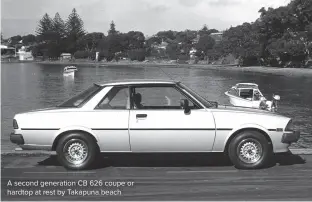  ?? ?? A second generation CB 626 coupe or hardtop at rest by Takapuna beach