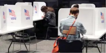  ?? CHARLIE RIEDEL/AP FILE ?? People cast their ballots on Nov. 3, 2020, in Kansas City, Mo. Some state lawmakers are taking extra steps to prevent noncitizen­s from voting.