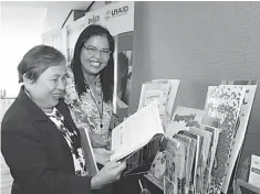  ??  ?? Tagbilaran City Curriculum Implementa­tion Division Chief Elisea dela Torre and Bohol Assistant Schools Division Superinten­dent Casiana Caberte