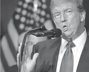  ?? MANDI WRIGHT/DETROIT FREE PRESS ?? Donald Trump speaks at a news conference in the Monroe Meeting Rooms at DeVos Place in Grand Rapids on Tuesday.