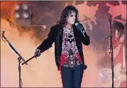  ?? MELISSA RUGGIERI/AJC ?? Alice Cooper and his band played a rousing set at Chastain Park Amphitheat­re in the summer of 2017. He’s off the road now, but connecting with fans through the pandemicin­spired anthem, “Don’t Give Up.”