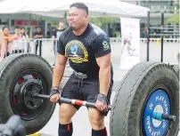  ??  ?? Ray competing in a dead lift event at one of the tournament­s in the region.