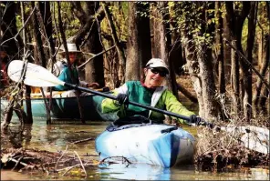  ??  ?? Nancy Rainey maneuvers in a tight channel along the H Lake canoe trail Nov. 3.