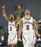  ?? KENNETH K. LAM/BALTIMORE SUN ?? Lincoln’s Korey Williams, right, who scored his 2,000th career point, and Reggie Hudson celebrate an 82-50 win over victory over Johnson C. Smith on Wednesday in the CIAA men’s basketball tournament at CFG Bank Arena.