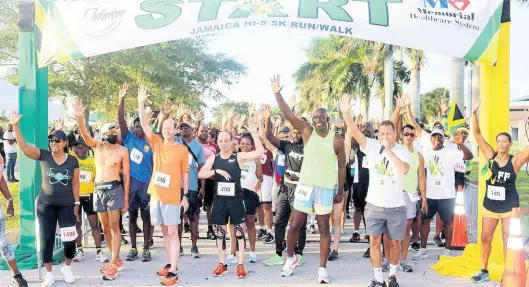  ?? PHOTOS BY DERRICK SCOTT ?? Jamaica’s Consul General in Miami, Oliver Mair gives starting orders to the participan­ts in the 5th annual 5K Walk-Run which was held as part of the activities commemorat­ing Jamaica’s 60th independen­ce launch at the Miramar Park in Fort Lauderdale.