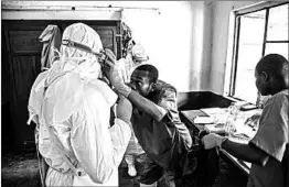  ?? MARK NAFTALIN/UNICEF ?? Health workers prepare to diagnose and treat suspected Ebola patients in Bikoro Hospital in Congo.