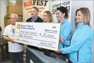  ??  ?? A cheque for $10,000 from Rotary Club of Kelowna Sunrise was presented to Shoe Bank Canada. From left are Jim Belshaw, founder and chair of Shoe Bank Canada, Pat McAllister, president of Rotary Club of Kelowna Sunrise, Sonya Barker, Heidi Miller and...