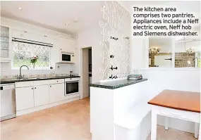  ?? ?? The kitchen area comprises two pantries. Appliances include a Neff electric oven, Neff hob and Siemens dishwasher.