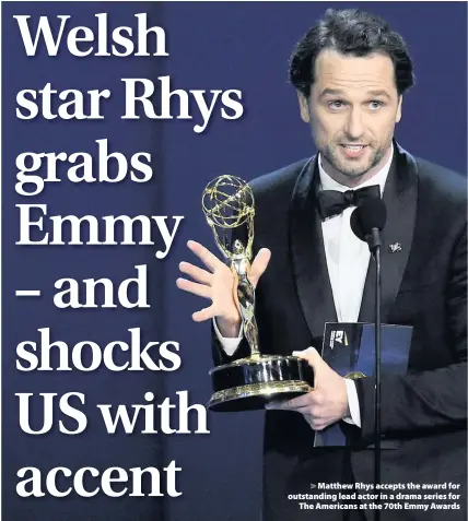  ??  ?? &gt; Matthew Rhys accepts the award for outstandin­g lead actor in a drama series for The Americans at the 70th Emmy Awards