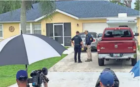  ?? CURT ANDERSON/AP ?? Authoritie­s investigat­e Brian Laundrie’s parents’ home in North Port, Fla., on Monday, in connection with the disappeara­nce of Gabby Petito.