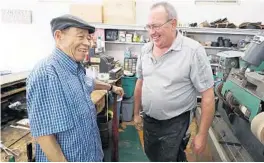  ?? STEPHEN M. DOWELL/ORLANDO SENTINEL PHOTOS ?? Longtime Eustis shoe repairman Robert Dunston, left, is pictured with Tim Desabrais at Eustis Shoe & Leather Repair (formerly Dunston’s Shoe Hospital) on Tuesday.