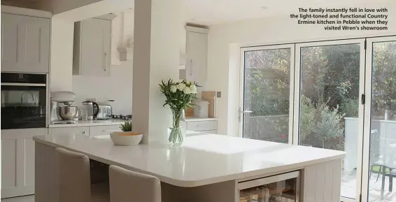  ??  ?? The family instantly fell in love with the light-toned and functional Country Ermine kitchen in Pebble when they
visited Wren’s showroom