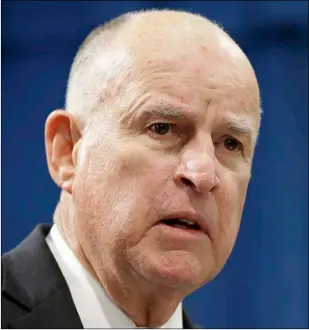  ??  ?? In this Jan. 10 file photo Gov. Jerry Brown listens to a question concerning his proposed 2018-19 state budget at a news conference in Sacramento. Brown is paring down his troubled proposal for redoing California’s north-south water system, in hopes of...