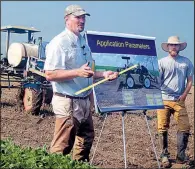  ?? Arkansas Democrat-Gazette/STEPHEN STEED ?? Jason Norsworthy, a University of Arkansas weed scientist, talked to field day visitors in Keiser about the tendency of the herbicide dicamba to drift from fields.