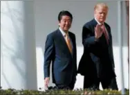  ?? EVAN VUCCI — THE ASSOCIATED PRESS ?? In this file photo, Japanese Prime Minister Shinzo Abe walks with U.S. President Donald Trump to a news conference at the White House in Washington.