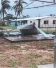  ?? Picture: LIAM HARTLEY ?? MANGLED: Damage from Cyclone Nora to a shed at Pormpuraaw.